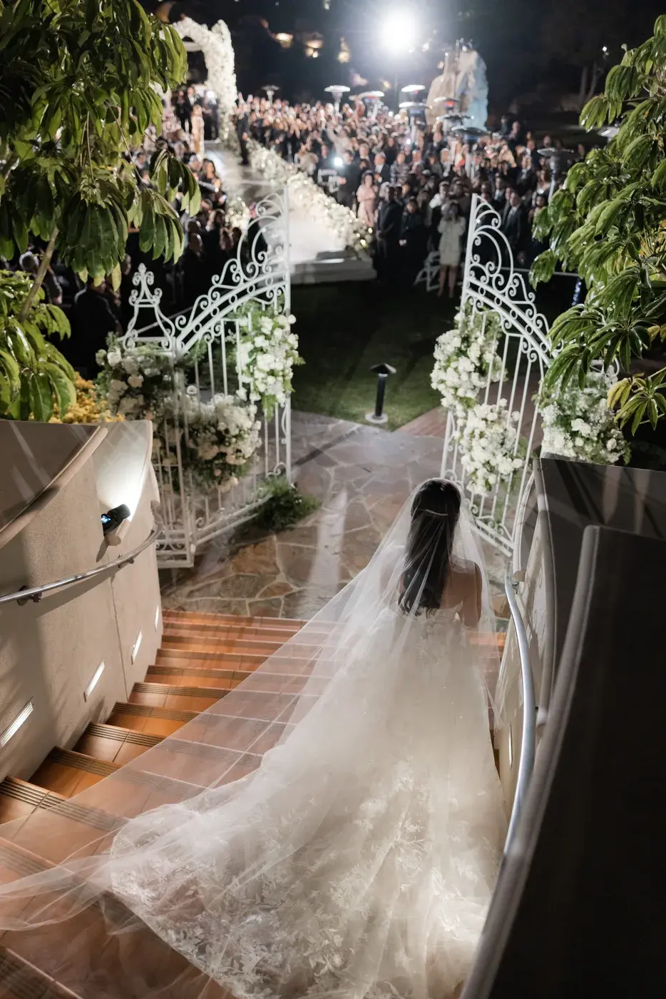 The bride on the stairs at night at the Four Seasons Hotel Westlake Village.