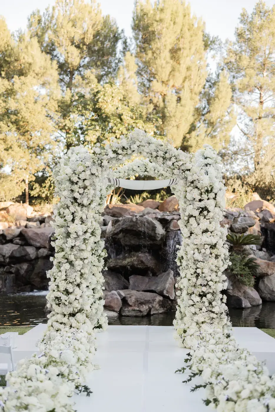 White floral chuppah prepared for the ceremony at the Four Seasons Hotel Westlake Village.