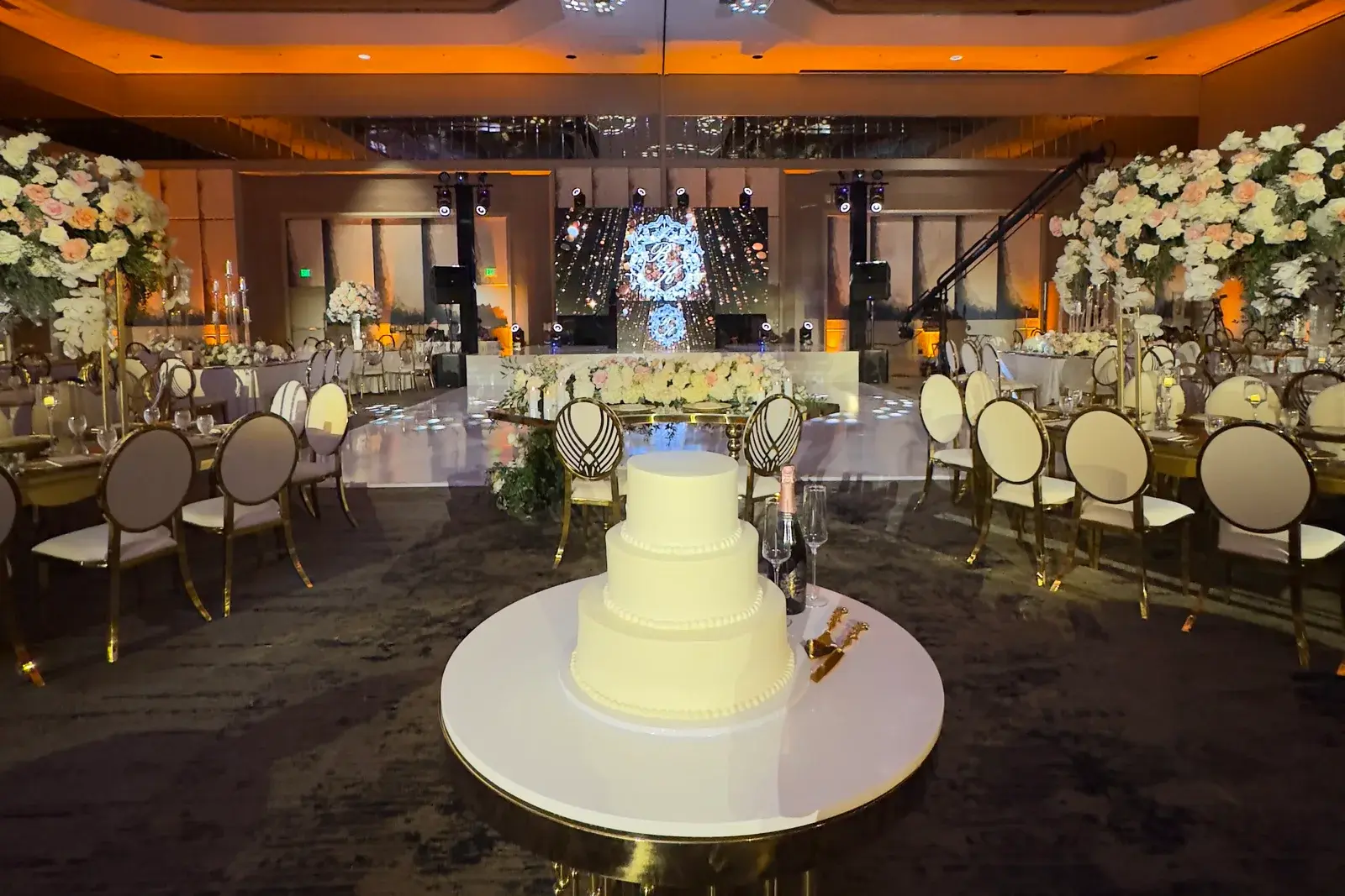 LED video wall, moving lights and warm uplighting at a wedding reception in the Hilton Universal City ballroom