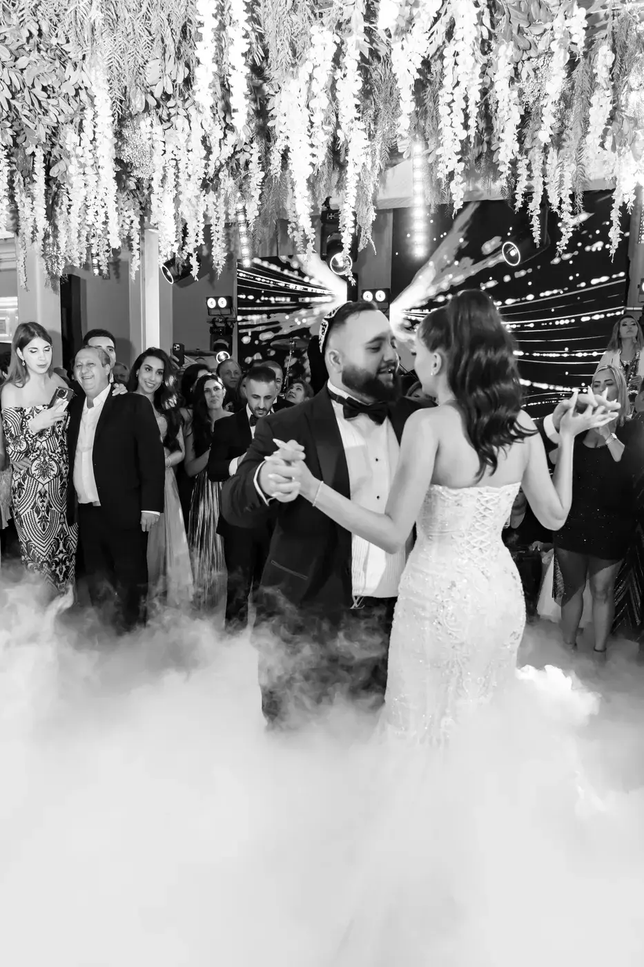 Black-and-white first dance, dancing on the clouds of dry-ice fog under a floral ceiling at The Ritz-Carlton, Marina del Rey.
