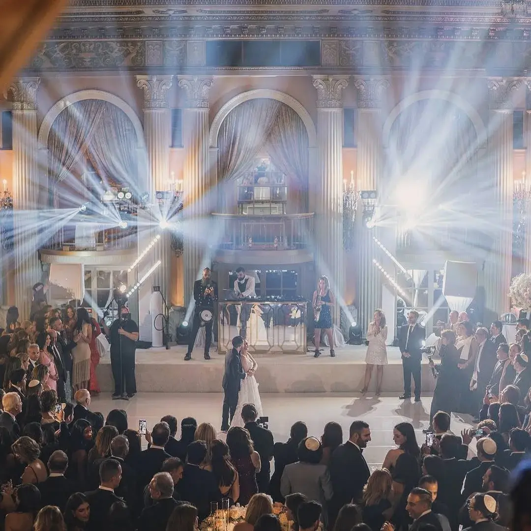 First dance in a Los Angeles ballroom with beam lighting, live saxophone and percussion alongside the DJ, produced by DJ Next Level Entertainment