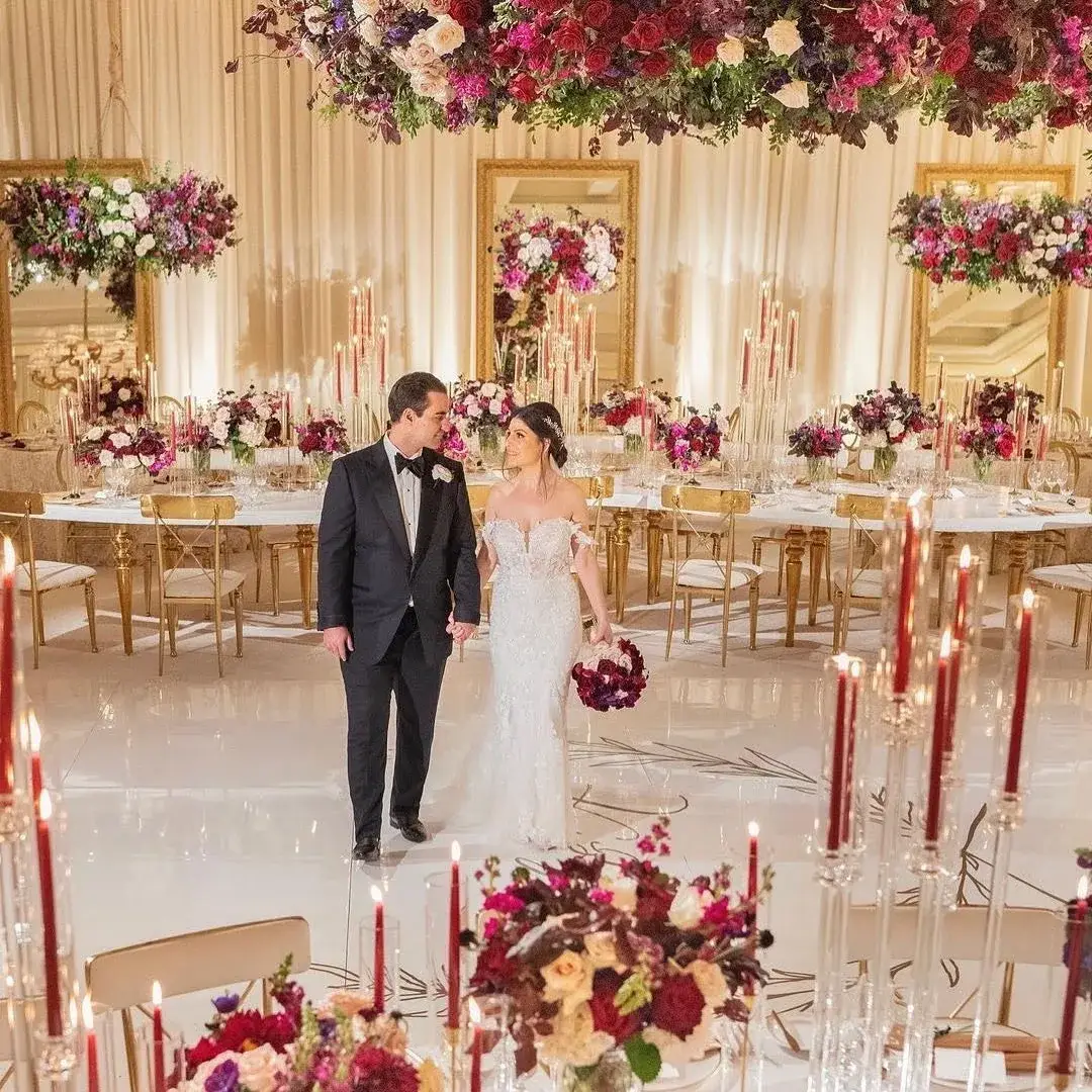 Warm event uplighting and moving-head fixtures at a Los Angeles celebration