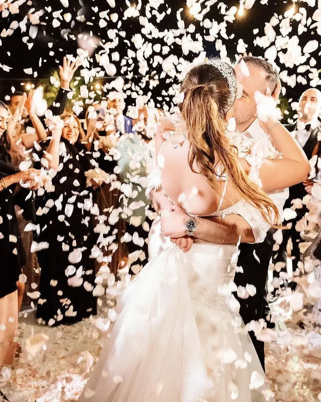 A photogenic first-dance moment under a petal shower captured at a luxury Los Angeles wedding produced by NEXT LEVEL EVENTS
