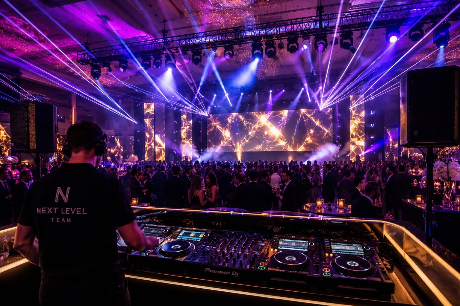 Intelligent lighting and moving-head beams over a luxury multicultural wedding dance floor